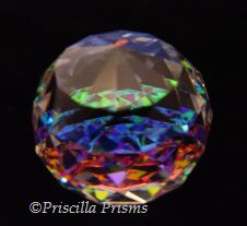 Colors explode from this crystal faceted paperweight